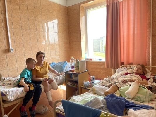 On 12 May 2022 in Ukraine, 11-year-old Yaroslav takes care of his mother Natalia and twin-sister Yana. Photo Courtesy: UNICEF