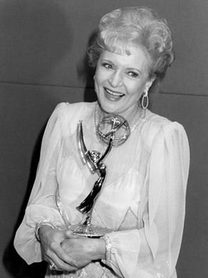 Betty White holding an Emmy award